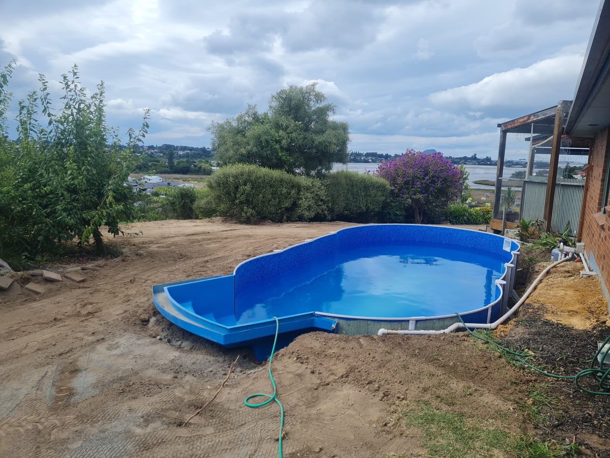 A new blue liner pool with its own step bay, set into a lawn
