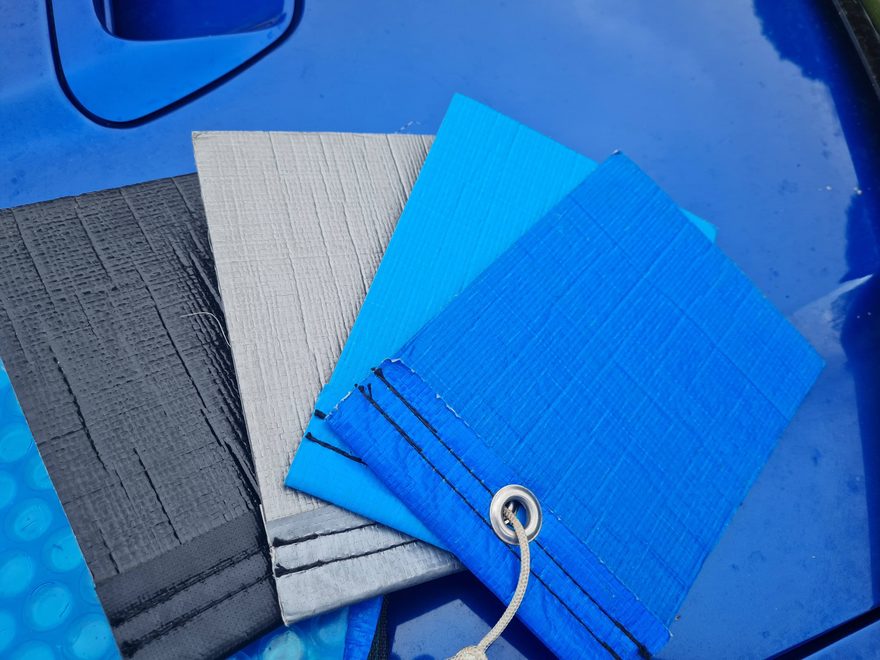 Liner samples in grey and blue for a pool liner replacement